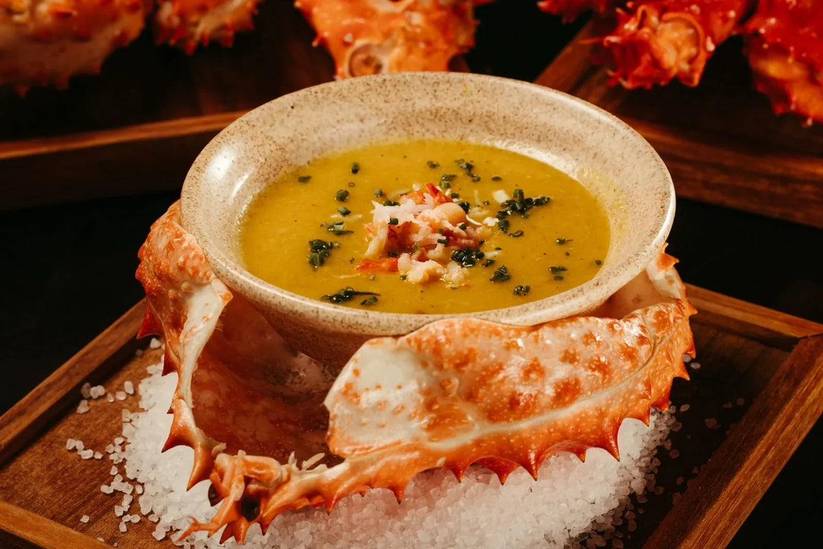 Rich crab bisque garnished and served in a crab shell