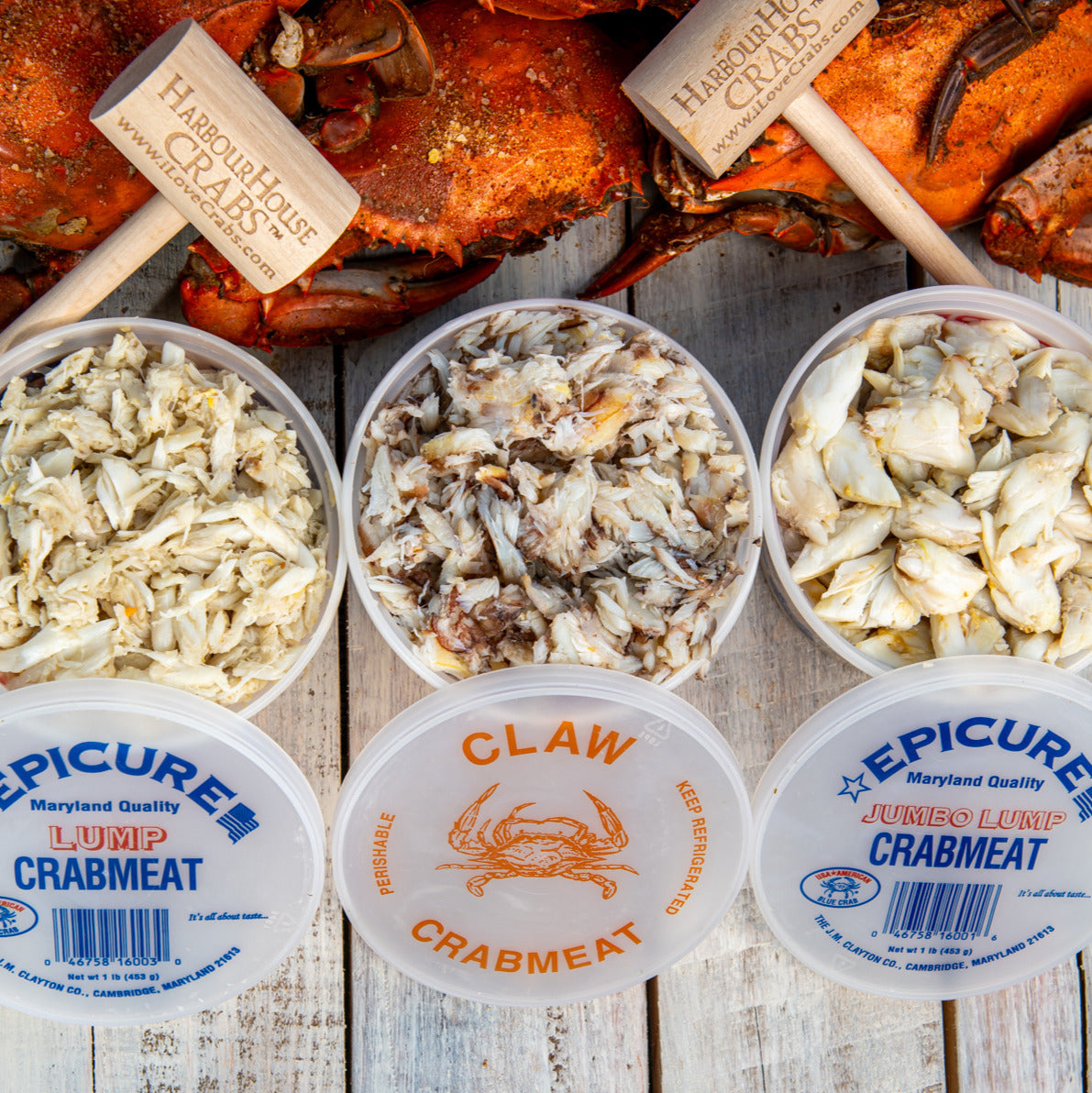 Lump, claw and jumbo lump crab meat in open tubs, side by side