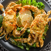 Prime soft shell crabs, two fried crispy and served with lemon slices