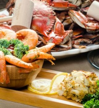 Seafood feast: steamed blue crabs, seasoned shrimp and a crab cake