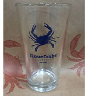 Clear pint glass printed with a blue crab and iLoveCrabs Collection logo