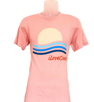 Pink iLoveCrabs summer T-shirt with a sunset and waves graphic