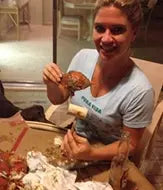 Customer holding a steamed crab