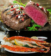 Beef tenderloin cut to show a pink center above king crab legs